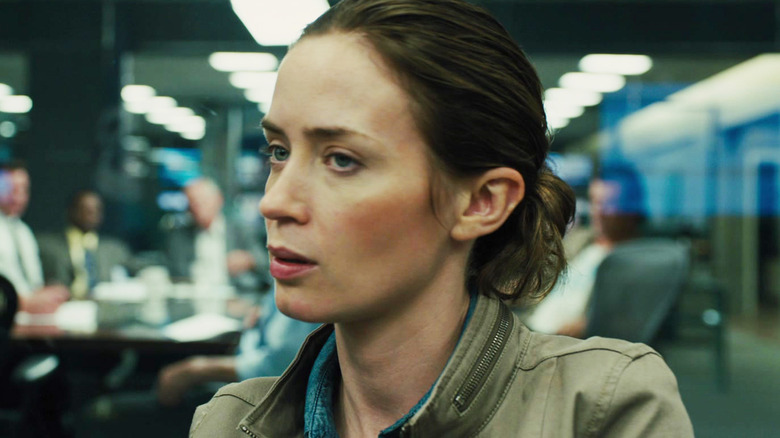 Emily Blunt's Kate Macer sits in an office in Sicario