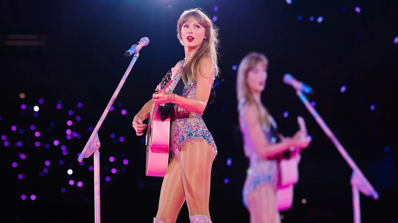 Taylor Swift Eras Tour movie pink guitar 