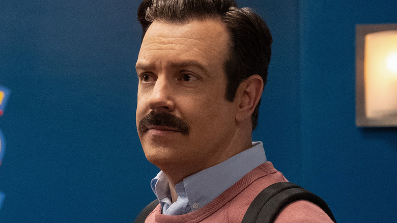 Ted Lasso wearing a salmon shirt in Ted Lasso