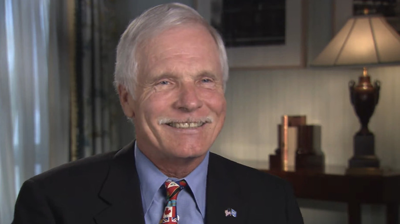 Ted Turner smiling during an interview with the American Academy of Achievement