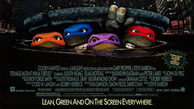 The Turtles emerging from the sewer on the poster for Teenage Mutant Ninja Turtles (1990)