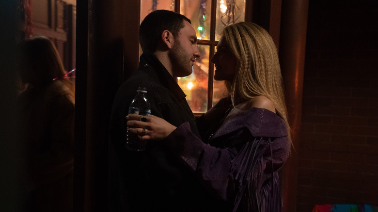 Stephen and Lucy talking closely at a party on Tell Me Lies