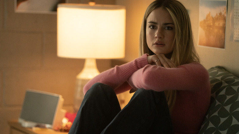 Lucy looking horrified sitting on her bed in Tell Me Lies