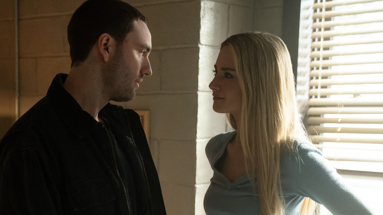 Stephen and Lucy looking at each other in a dorm room on Tell Me Lies