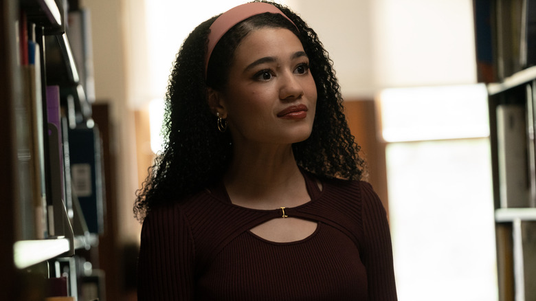 Diana looking at someone in the library on Tell Me Lies