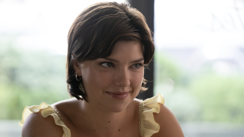 Bree smiling wearing a yellow top on Tell Me Lies