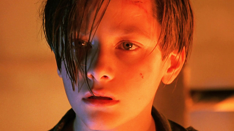 Edward Furlong's John Connor is seen in closeup illuminated by orange light in Terminator 2 Judgmenet Day