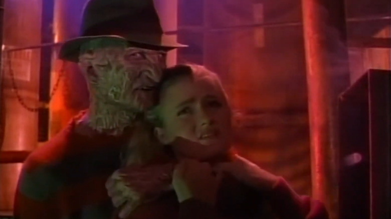 Freddy holding a woman hostage in Freddy's Nightmares