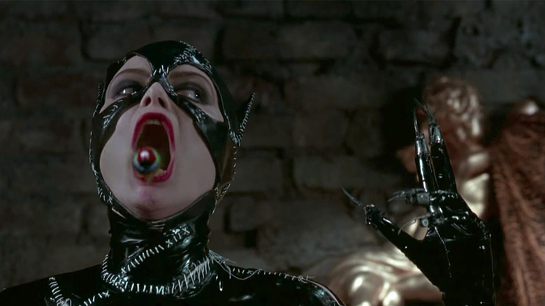 Catwoman (Michelle Pfeiffer) releases a bird from her mouth in Batman Returns