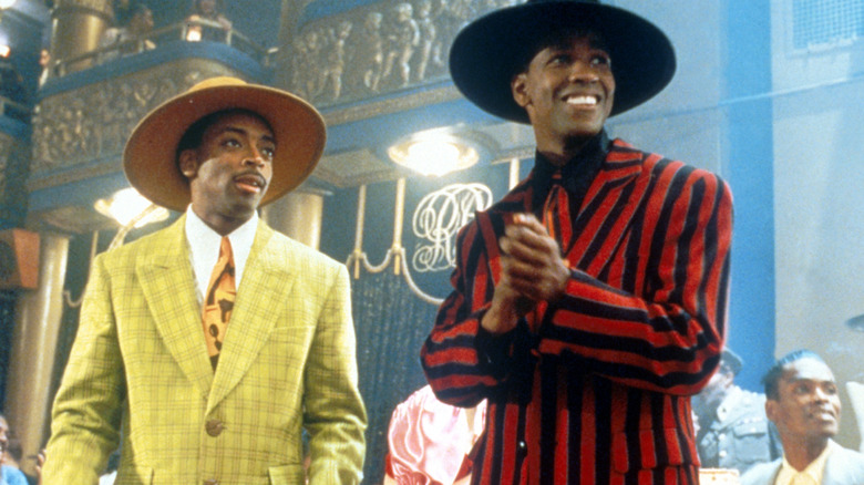 Shorty (Spike Lee) and Malcolm (Denzel Washington) smiling in Malcolm X