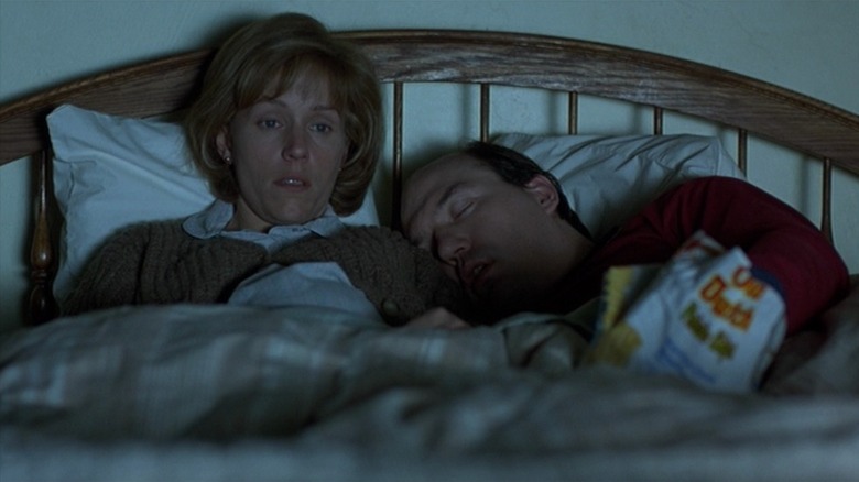 Marge (Frances McDormand) and Norm (John Carroll Lynch) watch TV in bed in Fargo