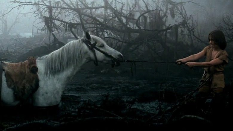 Atreyu pulling Artax through the Swamps of Sadness in The Neverending Story