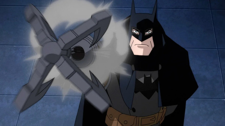 Batman firing his grappling hook gun in Batman: Gotham by Gaslight