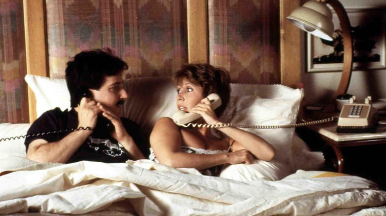 Jess and Marie on the phone in bed