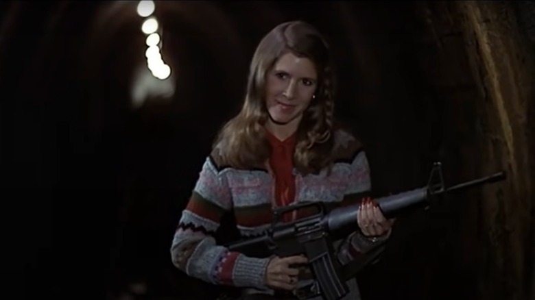 Mystery Woman holding a gun