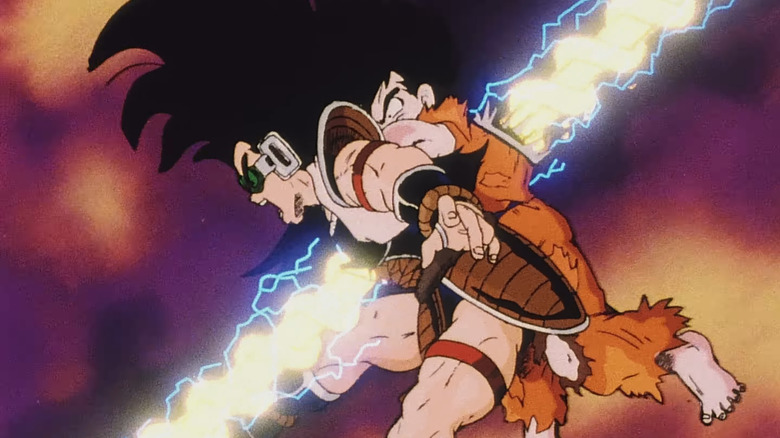 Goku holds Raditz as the two are hit with an energy beam in Dragon Ball Z