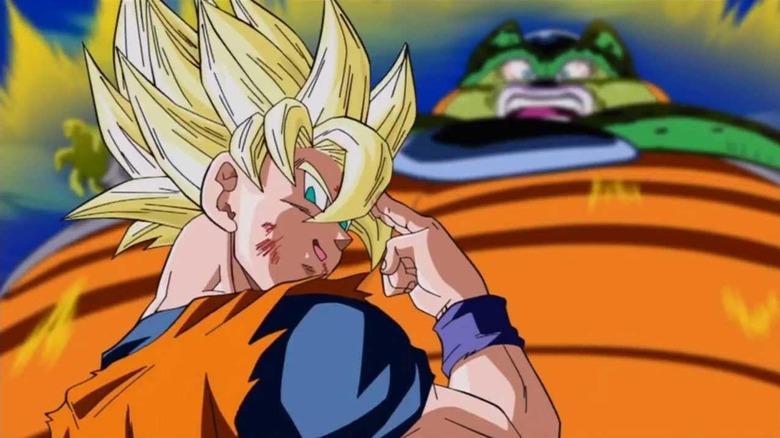 Goku looks bad in acknowledgement while a scared Cell looks at him in Dragon Ball Z