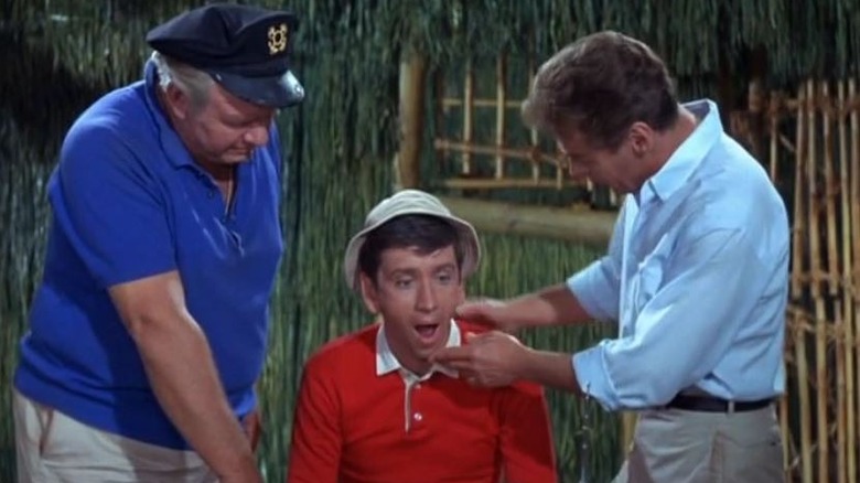 Alan Hale Jr. as Skipper and Russell Johnson as the Professor examining Bob Denver as Gilligan on Gilligan's Island