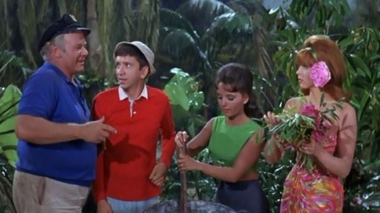 Alan Hale Jr. as Skipper, Bob Denver as Gilligan, Dawn Wells as Mary Ann, and Tina Louise as Ginger Grant in the jungle on Gilligan's Island