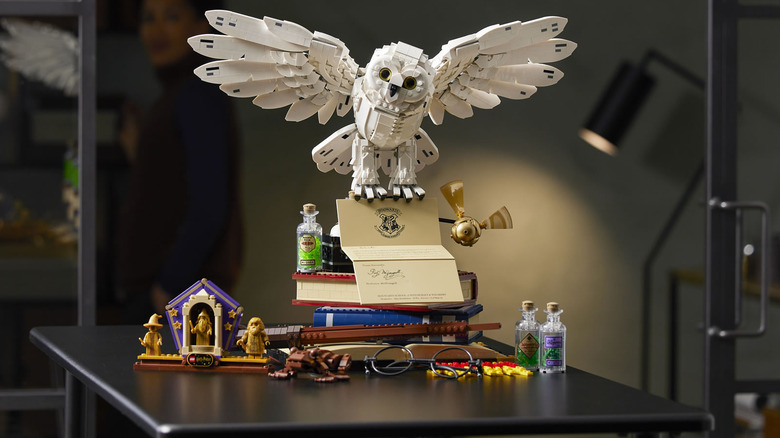 The LEGO Hogwarts Icons Set displayed on a dark desk