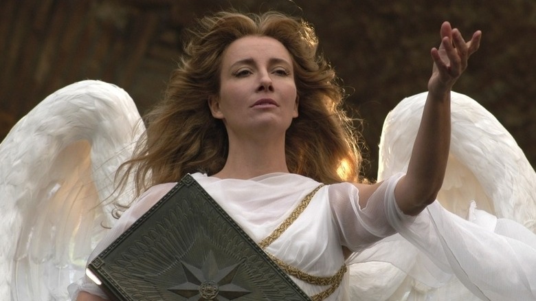 Emma Thompson holds up her left hand as the Angel in Angels in America