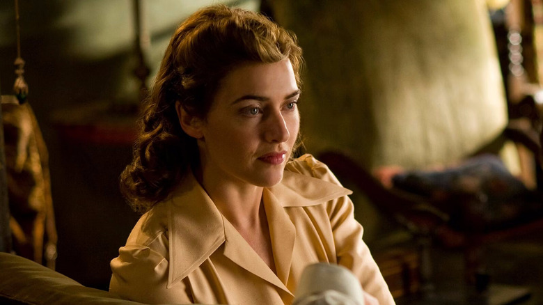 Kate Winslet looks at someone as Mildred Pierce in Mildred Pierce