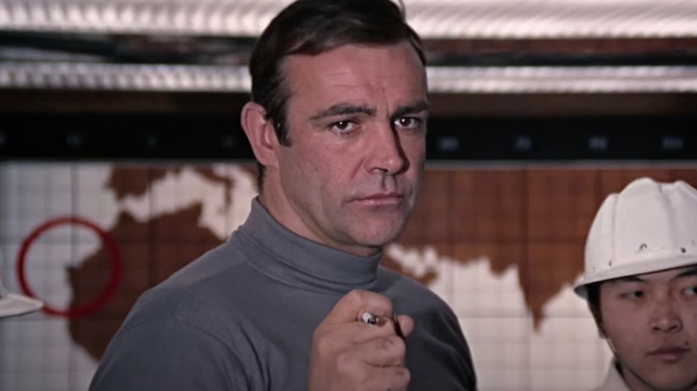 Sean Connery as James Bond aims is Mini-rocket Cigarette in You Only Live Twice