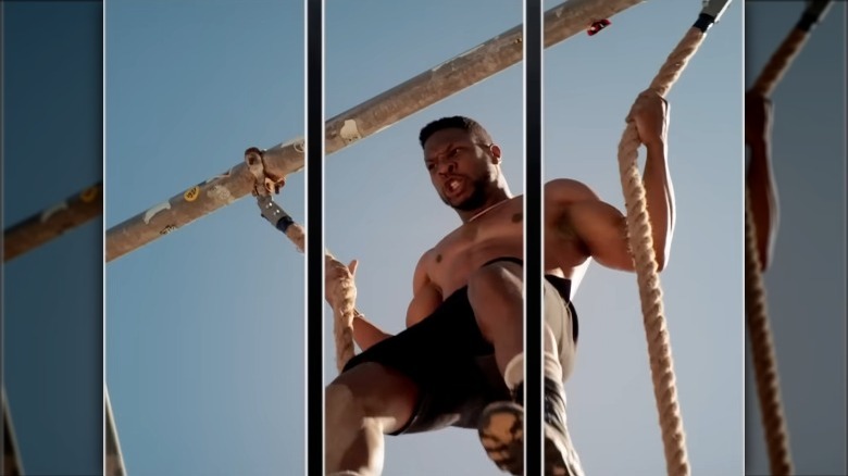 Dame climbing the ropes