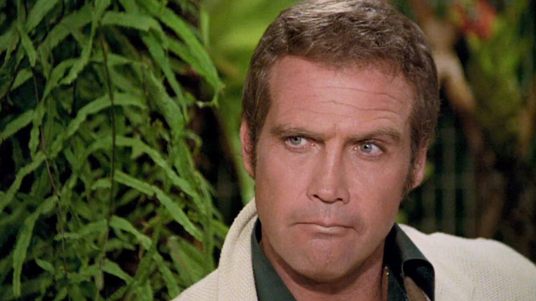 Lee Majors as Robert glaring in Killer Fish
