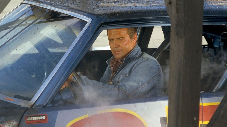 Lee Majors as Colt, driving a race car in The Fall Guy