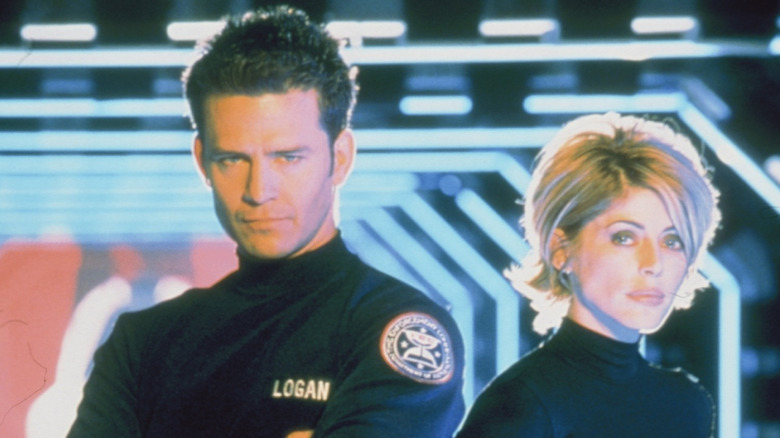 Ted King's Jack Logan and Cristi Conaway's Claire Hemmings posing in Timecop