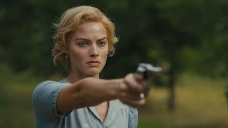 Margot Robbie fires gun
