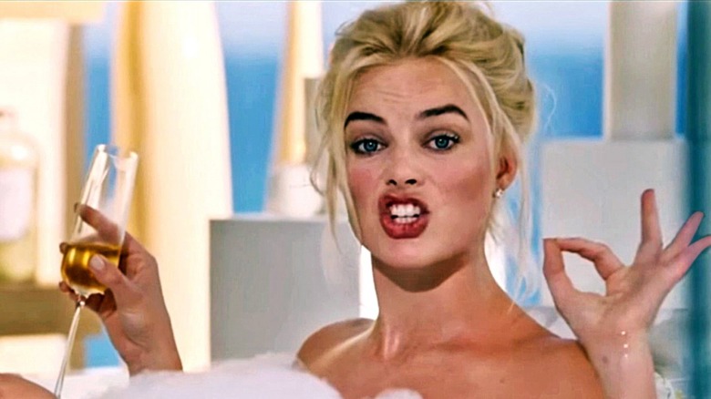 Margot Robbie drinks champagne in bath