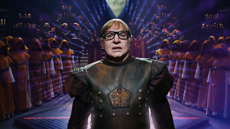 Mike Myers frowning in "The Pentaverate."