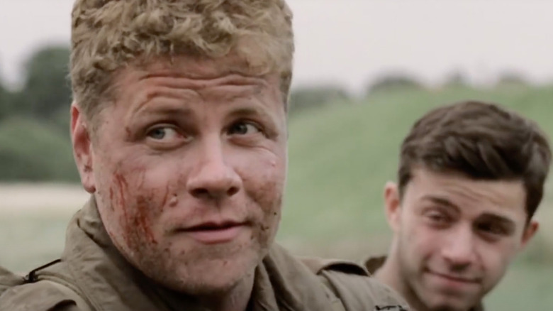 Bull sits with another soldier