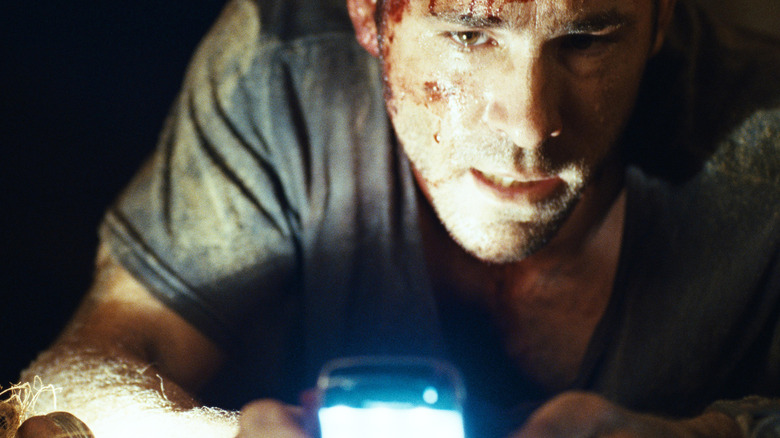 Ryan Reynolds as Paul in Buried, trapped in a coffin