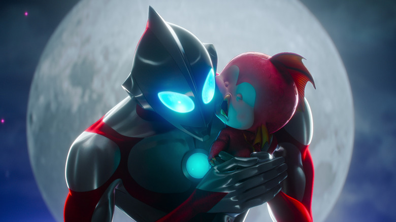 Ultraman hugging a baby monster with the moon in the background from Ultraman: Rising