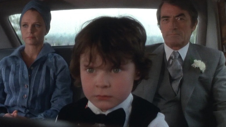 Damien in car with parents