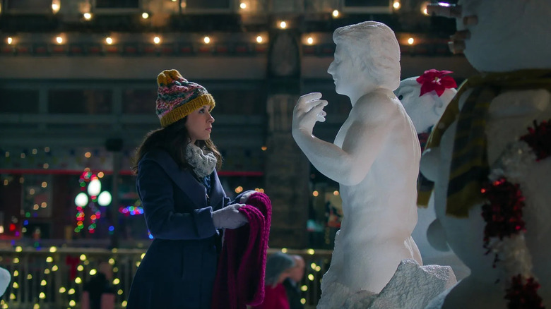 Lacey Chabert as Kathy looking at the snowman in Hot Frosty