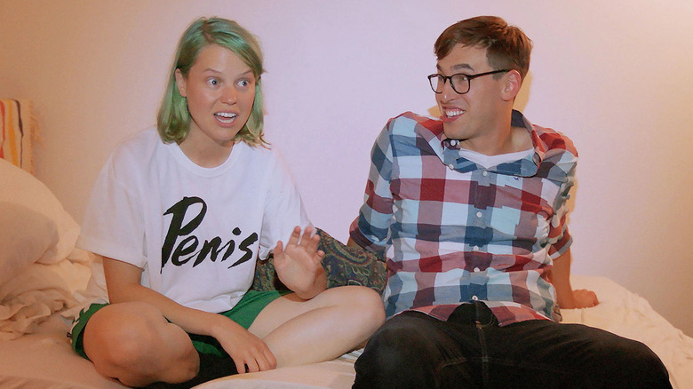 Ally Beardsley and Grant O'Brien sitting on a bed in Total Forgiveness