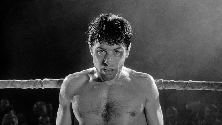 Robert De Niro as Jake LaMotta stands in a boxing ring in Raging Bull