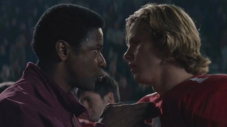 Denzel Washington as Herman Boone coaches Ronnie Bass (Kip Pardue) in Remember the Titans
