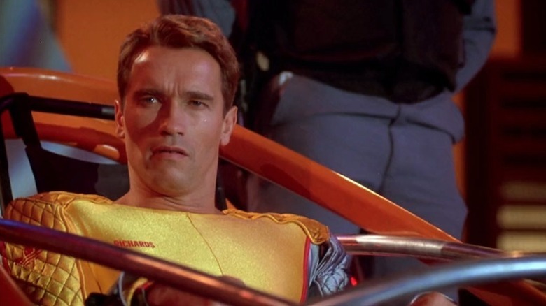 Arnold Schwarzenegger's Ben Richards in a yellow jumpsuit in The Running Man