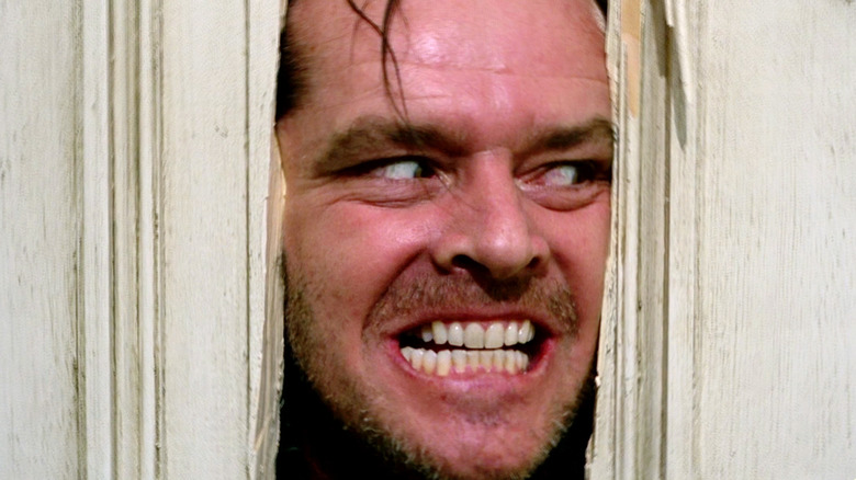 Jack Torrance looking through the door in The Shining