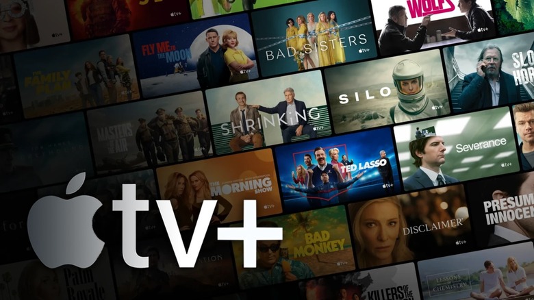 The Apple TV+ logo in front of many posters for the service's titles