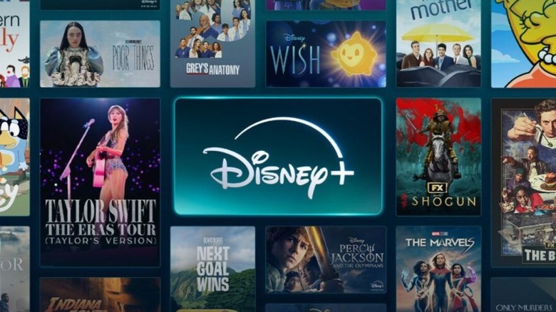 The Disney+ logo in front of a collage of posters for the service's titles