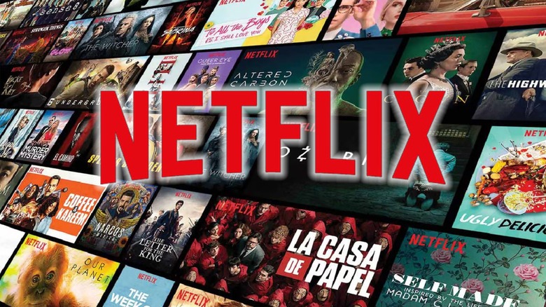 The Netflix logo in front of an immense catalogue of titles.