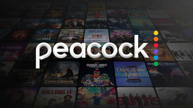 The Peacock logo in front of countless posters for the service's titles