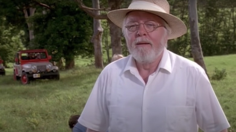 Jurassic Park hammond on grass in front of jeep