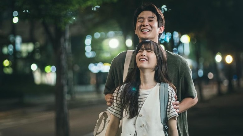 Ko Gyeom (Choi Woo-shik) guides Kim Mu-bee (Park Bo-young) with their eyes closed in Melo Movie